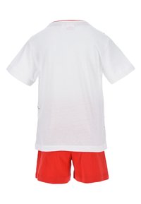 White cotton T-shirt with short sleeves and red trim, paired with red shorts. Simple design, no visible patterns or graphics.