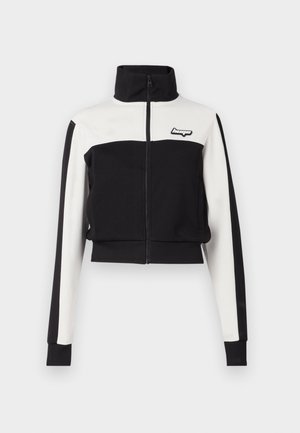 Cropped zip-up jacket featuring a black body with white upper panel and sleeves; ribbed cuffs; logo detail on the chest.