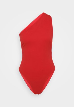 Red one-piece swimsuit with a singular shoulder strap, made of smooth, stretchy fabric, featuring a high-cut leg and minimalistic design.