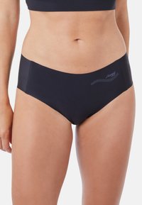 Schwarze Unterhose mit nahtlosem Design, gefertigt aus glattem Stoff. Verfügt über ein kleines Logo und ein dezentes Punktmuster am Bund.