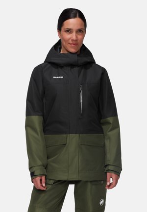 Black and green waterproof jacket with a hood, zippered chest pocket, and side pockets, featuring a sleek design and durable material.