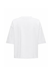 Απλό λευκό oversized t-shirt με κοντά μανίκια, χαλαρούς ώμους, στρογγυλή λαιμόκοψη και ίσια τελειώματα, εμφανίζεται από πίσω.