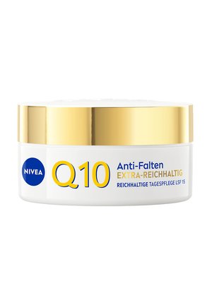 NIVEA Q10 anti-wrinkle cream jar with gold lid, labeled extra-rich day care with SPF 15 in German text on white background.