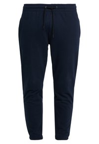 Marinblå joggerbyxor i mjukt tyg, med resårmidja och dragsko, avsmalnande ben och ribbade muddar.