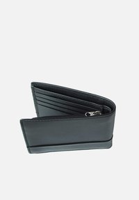 Black leather wallet with multiple card slots, a zipped compartment, and a smooth texture; features a stitched edge for durability.