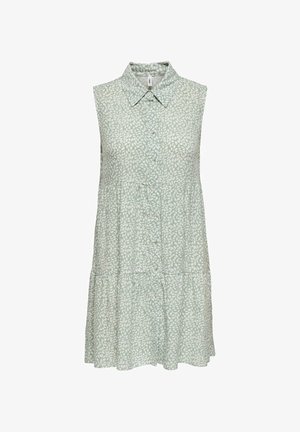 Robe sans manches vert clair avec motif de feuilles blanches, boutonnage devant, col pointu et jupe à volants.