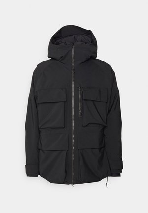 Black jacket with a hood, featuring multiple large pockets, a front zipper, and a smooth, matte finish. Adjustable cuffs and hem included.