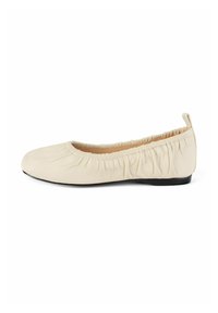 Beige leather ballet flats with gathered elastic trim around the opening and a low black sole. Smooth texture with a rounded toe design.