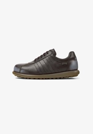 Brown leather sneaker with tonal stripes, rounded toe, and a beige rubber sole featuring textured grip. Lace-up design with six eyelets.