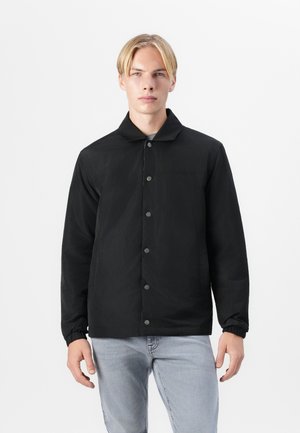 Black jacket made of lightweight fabric with a flat collar, button closure, and elastic cuffs. Simple design with no additional patterns or accents.