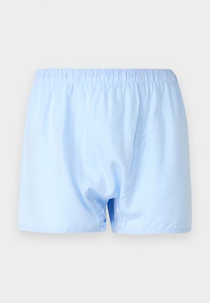 Light blue cotton boxer shorts with an elastic waistband and a relaxed fit. Smooth texture, no patterns or additional hardware.
