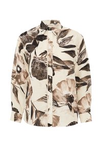 Blouse à manches longues en tissu crème avec un grand imprimé floral foncé, dotée d'une fermeture à boutons et d'un col classique. Texture douce, coupe décontractée.