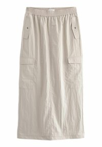 Jupe légère beige clair, arrivant aux genoux, en tissu léger. Elle dispose d'une taille élastique, de deux poches latérales et d'une surface lisse et texturée.