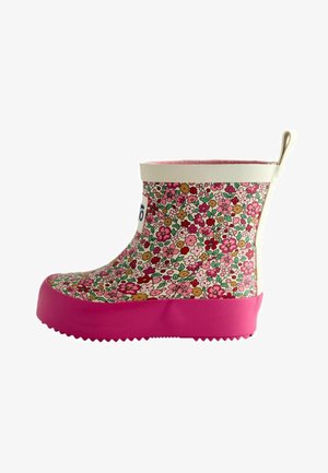 Botte de pluie pour enfant à la cheville avec motif floral rose, bordure blanche, languette beige et semelle et embout rose vif uni.