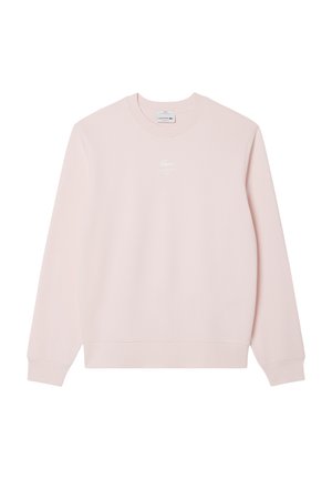 Light pink sweatshirt with a crew neck, long sleeves, and a small white Lacoste logo on the chest. Smooth fabric texture.