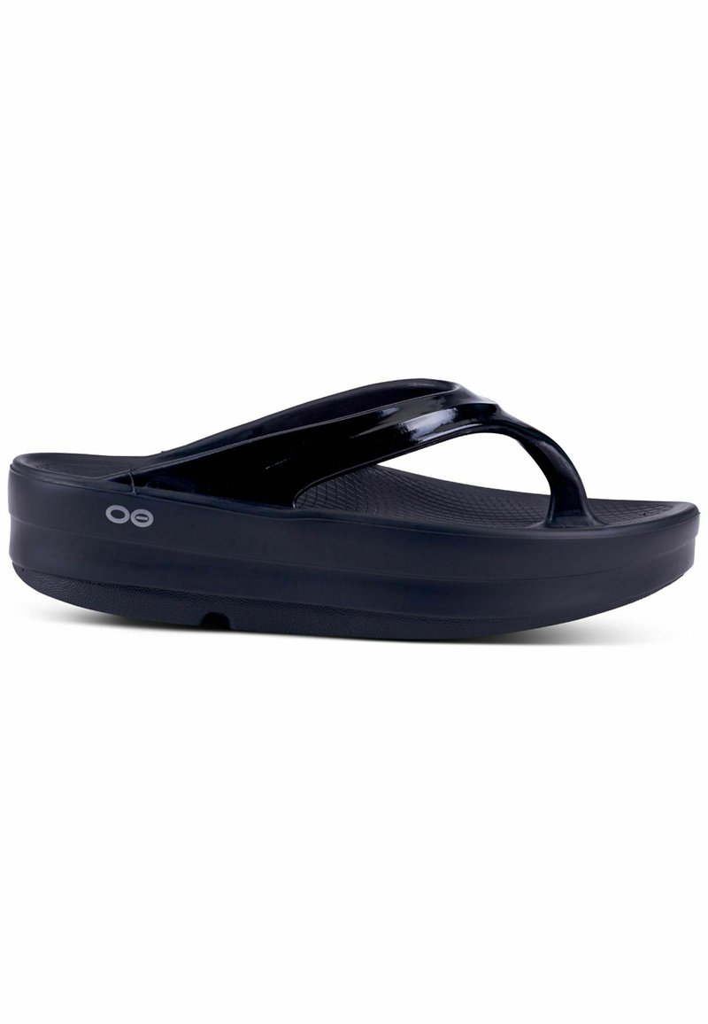 Black flip-flop sandals with a textured footbed, shiny straps, and a thick sole for cushioning, designed for comfort and durability.