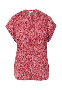 Blouse rouge à manches courtes dotée d'un motif en diamants et géométrique blanc. Design en col en V avec de légères plis aux épaules. Texture de tissu douce.