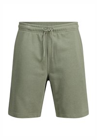 Green cotton shorts with a drawstring waistband, featuring a relaxed fit, smooth texture, and mid-thigh length. No pockets visible.
