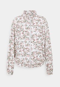 Vit lättviktsjacka med blommönster i rosa och grönt, hög krage och hel dragkedja fram, elastiska manschetter och en avslappnad passform.