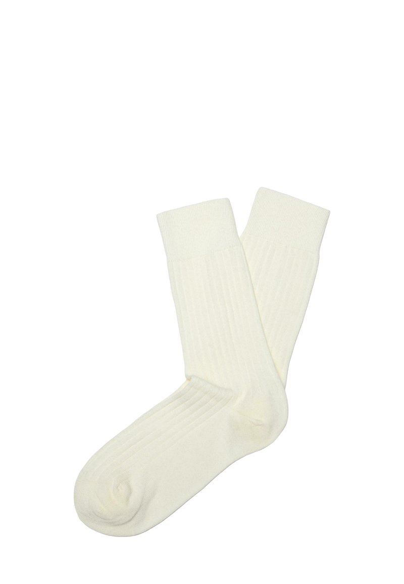 Baumwollsocken in Off-White, mit geripptem Textur und einer Höhe bis zur Mitte der Wade in schlichter Ausführung. Glatte Oberfläche ohne sichtbare Muster.