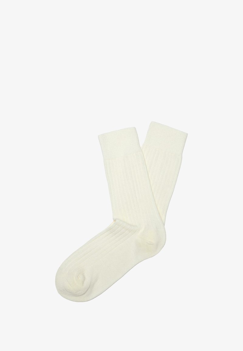 Baumwollsocken in Off-White, mit geripptem Textur und einer Höhe bis zur Mitte der Wade in schlichter Ausführung. Glatte Oberfläche ohne sichtbare Muster.