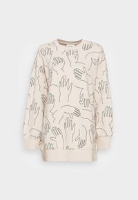 Crèmekleurige sweatshirt met handpatronen in zwarte lijnen en groene accenten. Het heeft een ronde halslijn en geribde manchetten.