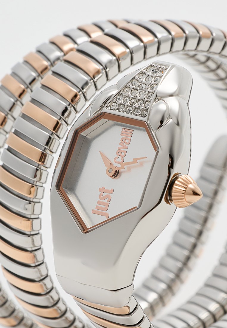 Silberne und roségoldene Uhr mit einem sechseckigen Zifferblatt, Kristallakzenten und einem flexiblen Armband aus abwechselndem Metallgliedern.