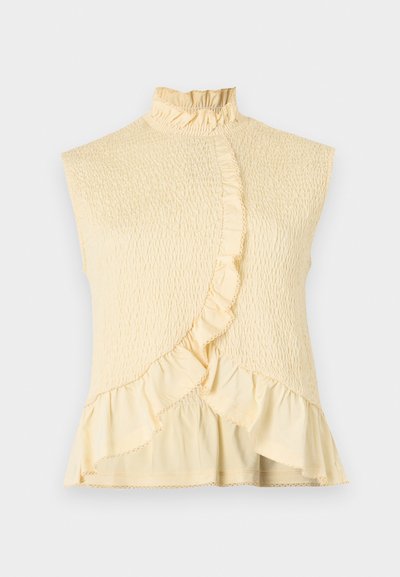 Blouse sans manches jaune clair avec col montant à volants, tissu smocké texturé et détail à volants le long du devant asymétrique et de l'ourlet.