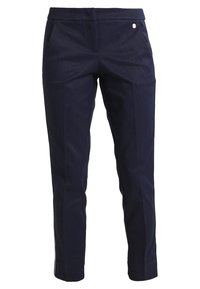 Marinblå skräddarsydda byxor i ett mjukt tyg, med sidofickor, slim fit och en liten dekorerande logotypdetalj på midjan.