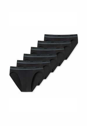 Six black men's briefs with "uncover" branded elastic waistbands arranged in a staggered row on a white background.