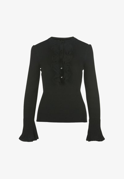 Top negro de mangas largas de canalé con cuello redondo, detalle de volantes central y cierres de botones, con puños acampanados en la muñeca.