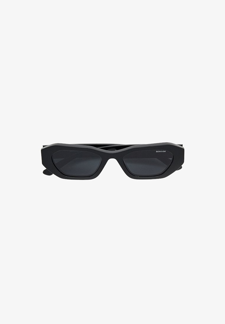 Black sunglasses with a geometric frame, featuring polarized lenses and unique angular design. Matte finish and sleek temples.