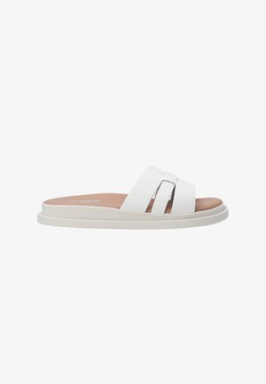 White slide sandals with two parallel straps, a padded footbed, and a flat, textured sole. Branding visible on the footbed.