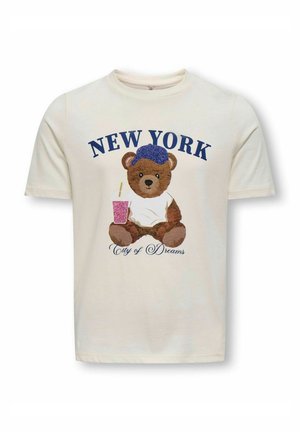 Cremefarvet t-shirt med korte ærmer, der viser en bjørn illustration med en blå glitrende hat, der holder en pink drik, og teksten "NEW YORK City of Dreams".