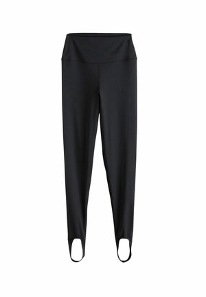 Black fitted leggings with a high waistband and stirrups at the ankles, displayed on a white background.