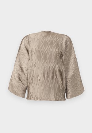 Beige pleated blouse with a boxy silhouette, wide sleeves, and textured ribbing pattern throughout. Smooth fabric with sheen.