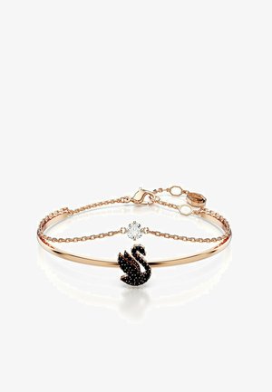 Armband aus Roségold mit einem schwarzen Schwamm-Anhänger, akzentuiert mit einem klaren Kristall. Ketten Design mit einer zarten, glatten Oberfläche.