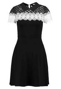 Schwarzes Kleid mit tailliertem Oberteil und ausgestelltem Rock. Verfügt über einen weißen Spitzen-Einsatz, strukturierte Kurzärmel und einen kragenförmigen Ausschnitt.