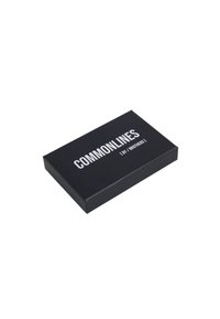 Rectangular black box with a matte finish, featuring bold white text reading "COMMONLINES ( by / BROTHERS )" on the top surface.