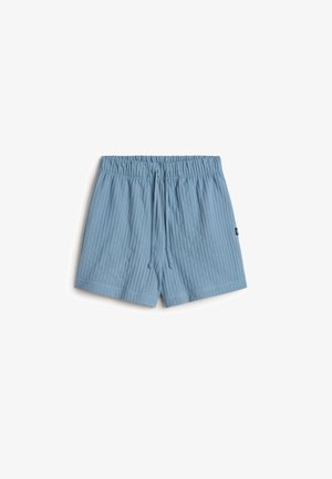 Shorts bleu clair avec une texture côtelée, taille élastique et cordon de serrage ajustable. Présente une petite étiquette sur le côté.