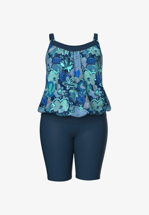 Hihaton kukkakuvioitu tankinitoppi, jossa säädettävät olkaimet, yhdistetty korkeavyötäröisiin tummansinisiin uimashortseihin.