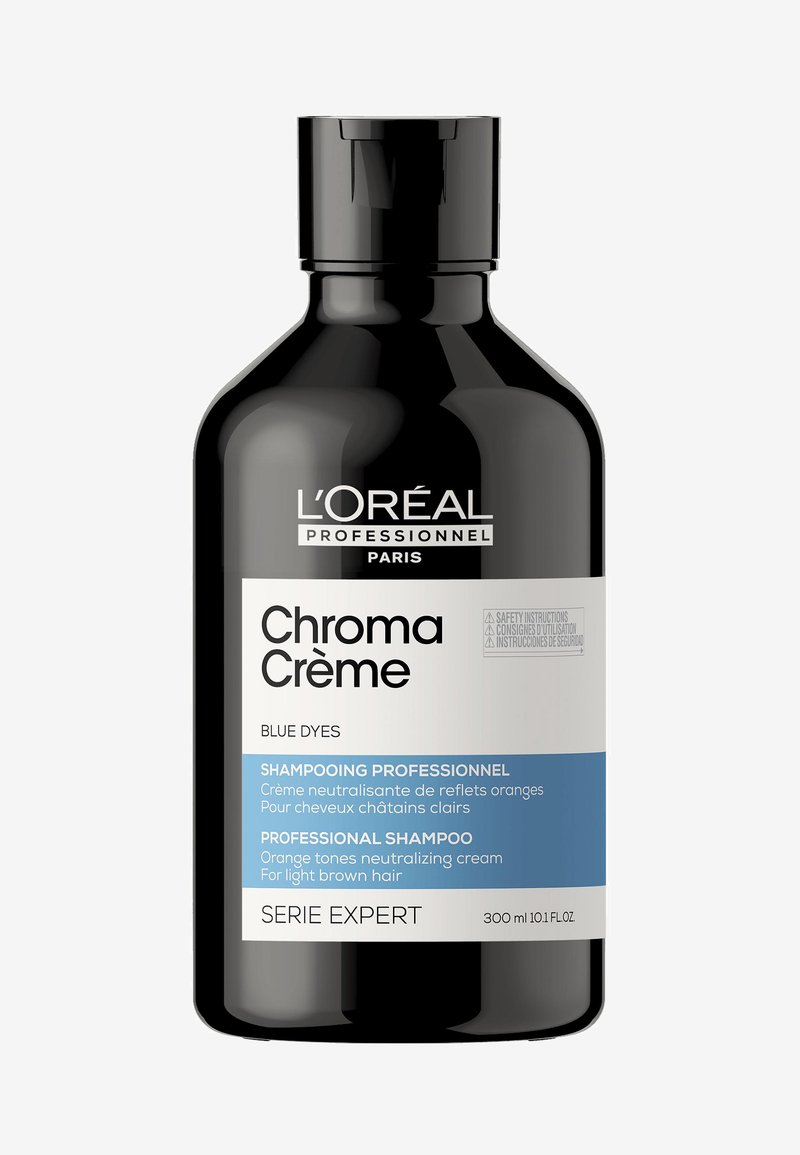 L’Oréal Professionnel Chroma Crème blue dye shampoo bottle for neutralizing orange tones in light brown hair, 300ml.