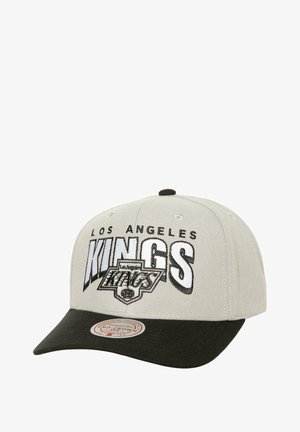 Gray cap with a black visor featuring "LOS ANGELES KINGS" in bold embroidery. Includes a circular logo tag on the visor's underside.