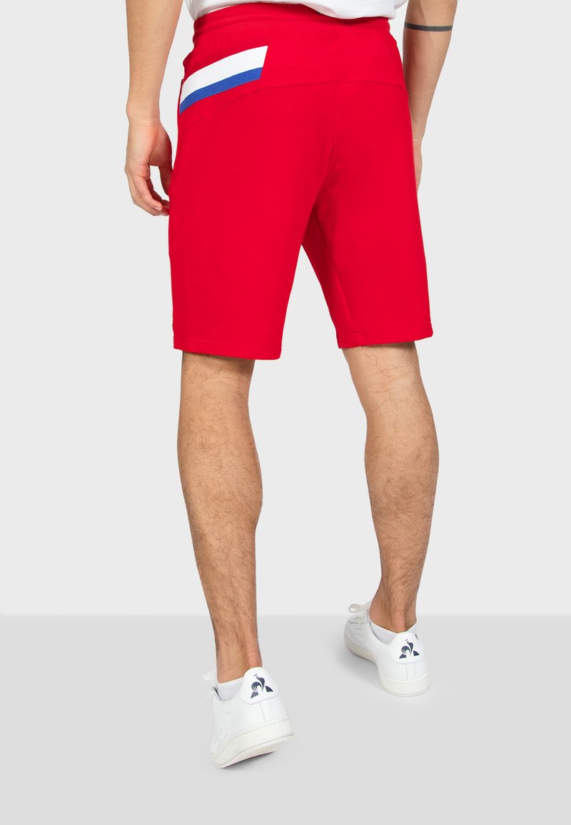 short le coq sportif homme jaune