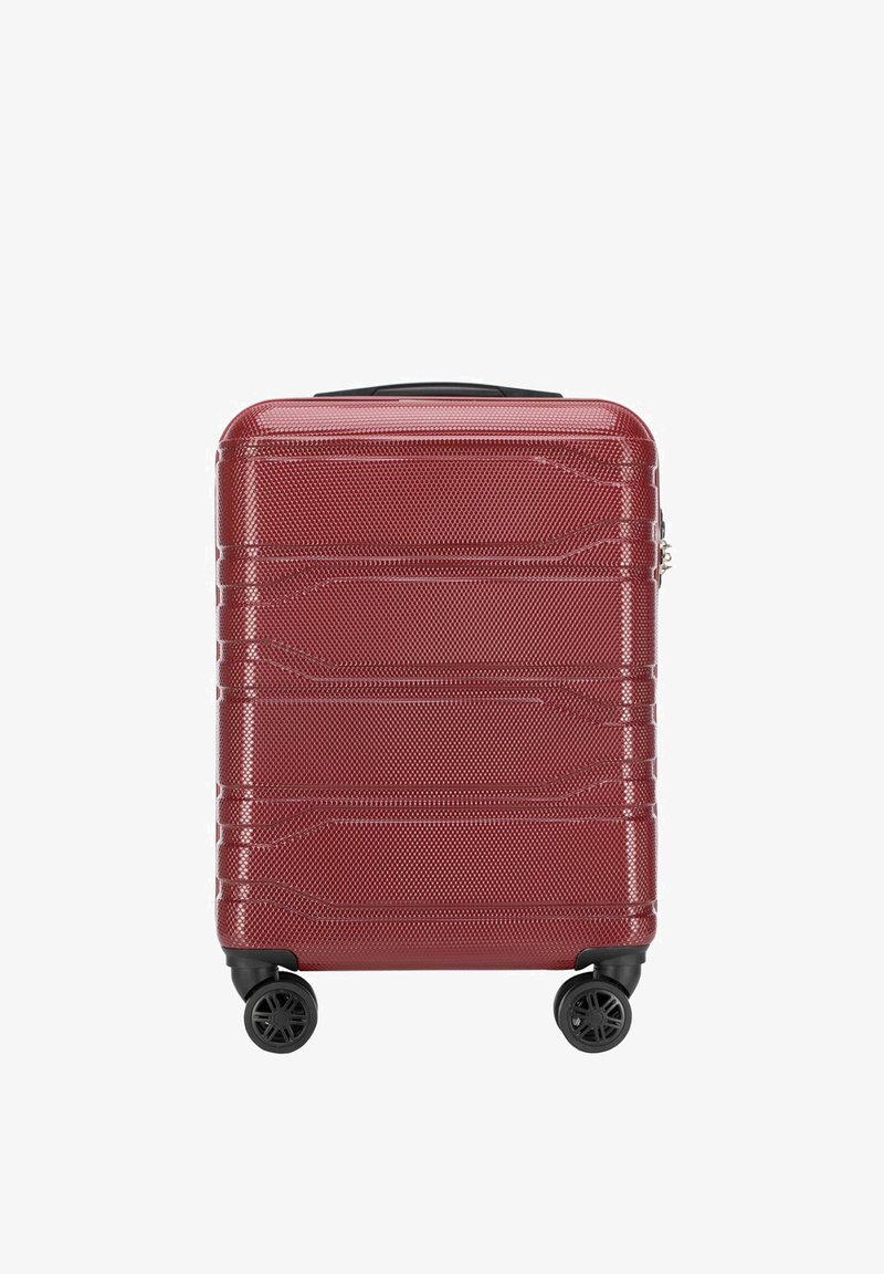 Valigia rigida rossa con superficie testurizzata, righe orizzontali, ruote nere e maniglia superiore per un facile trasporto.