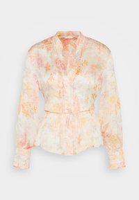 Blouse fluide à manches longues avec un motif floral pastel, décolleté en V, col mao et ceinture à nouer.