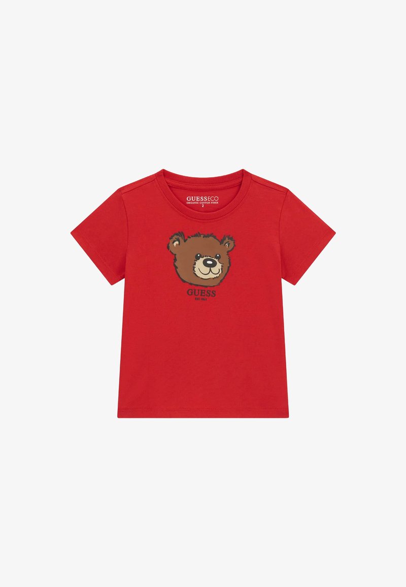 Punane orgaanilisest puuvillast T-särk, mille esitküljel on pruuni karu graafika. Lühikesed varrukad, ümar kaelus ja pehme tekstuur.