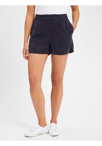 Marineblauwe shorts met een elastische tailleband en zijzakken. Gemaakt van lichtgewicht stof, met een relaxte pasvorm die halverwege de bovenbenen eindigt.