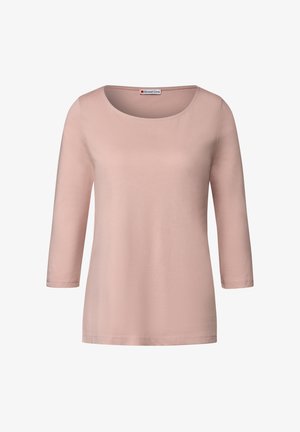 Lichtroze longsleeve T-shirt gemaakt van zachte katoen. Heeft een ronde halslijn en een eenvoudig ontwerp met een relaxte pasvorm. Merklabel zichtbaar.