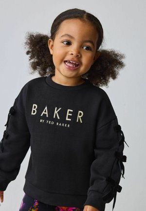 Černá mikina s výšivkou "BAKER" ve zlaté barvě a manžetami z sametové stuhy na rukávech. Měkká látka a pohodlný střih.